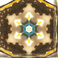 A kaleidoscopic wallpaper pattern featuring blue and earthy watercolor brushstrokes arranged in radial, prismatic symmetry.