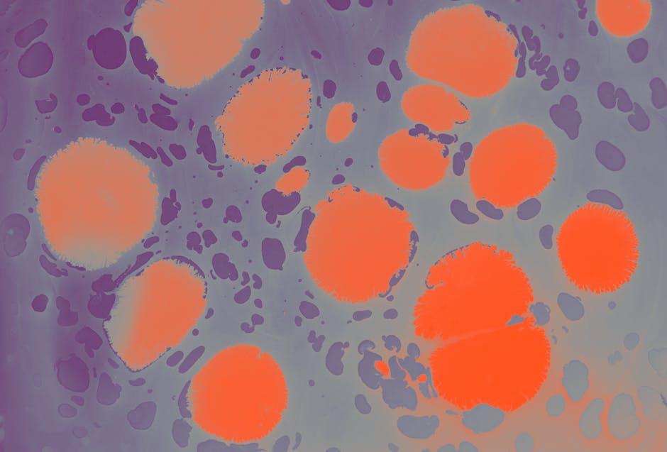Seamless mirror wallpaper pattern — Biochemistry by wallpaper⁶ — base photo: Colorful abstract artwork featuring orange spots on a purple background, showcasing dynamic shapes.