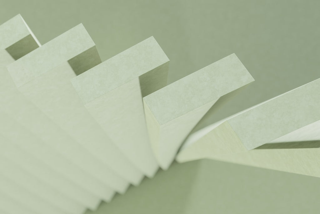 Seamless mirror wallpaper pattern — Origami by wallpaper⁶ — base photo: a stack of white papers sitting on top of a table