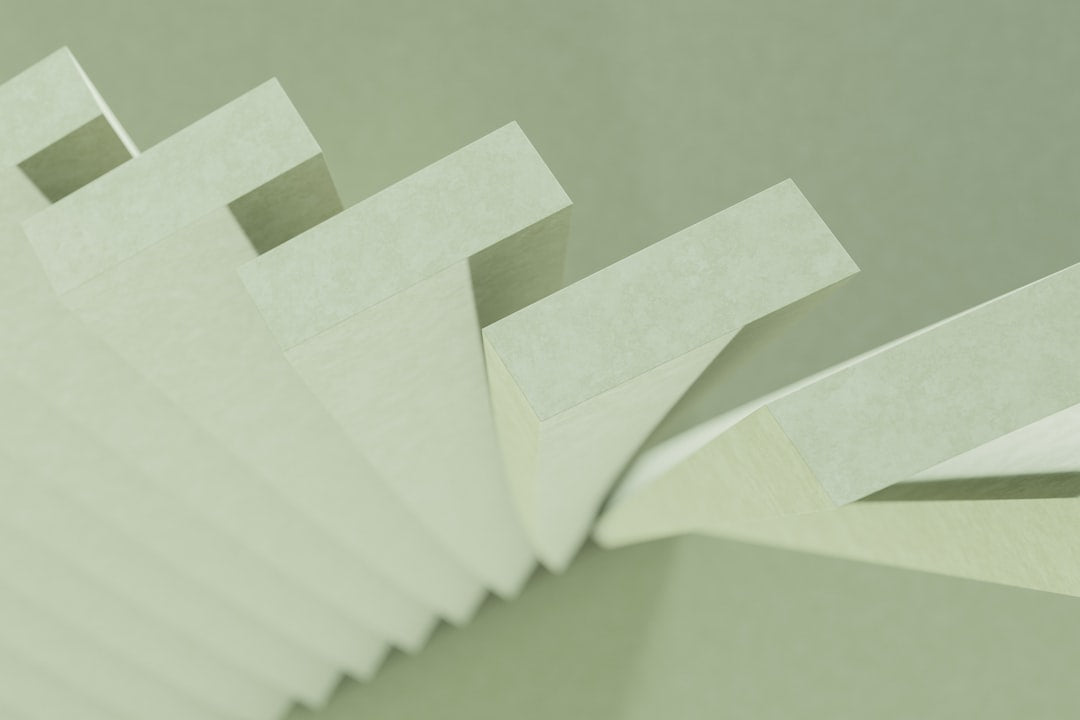 Seamless mirror wallpaper pattern — Origami by wallpaper⁶ — base photo: a stack of white papers sitting on top of a table