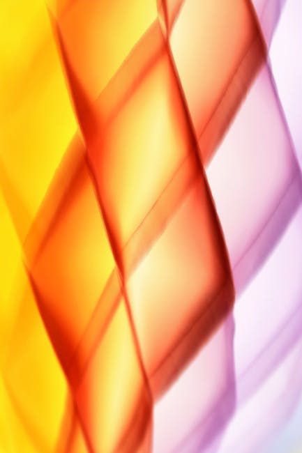 Seamless kaleidoscope wallpaper pattern — Stained Glass by wallpaper⁶ — base photo: Vivid abstract image featuring a colorful light pattern with yellow, orange, and pink tones.
