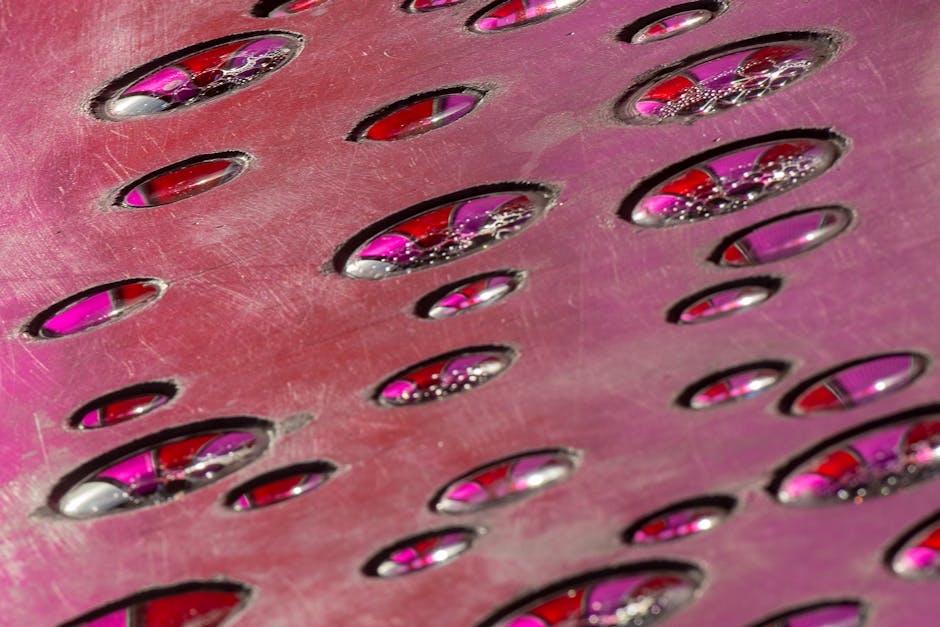 Seamless diamond wallpaper pattern — Stained Glass by wallpaper⁶ — base photo: Artistic close-up of a metallic surface with pink light reflections, creating an abstract design.