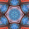 A geometric pattern resembling a kaleidoscope made from the details of leaded stained glass.