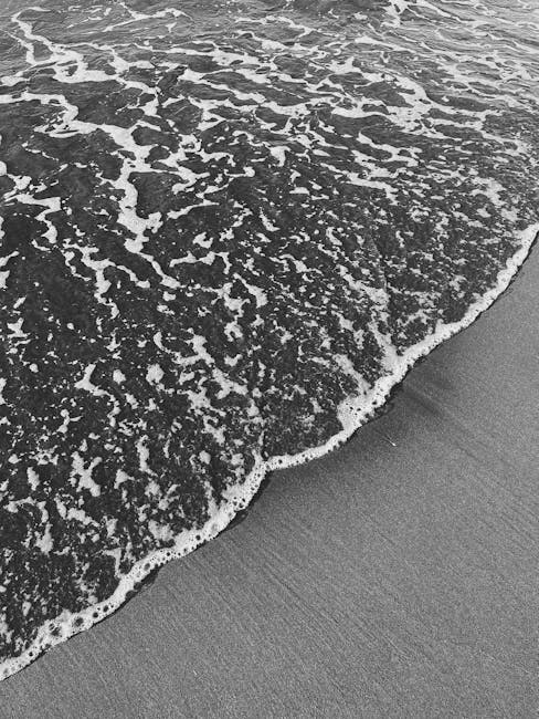 Oceanography Horizontal Strip wallpaper pattern — base photo: Black and white close-up of ocean waves meeting the sandy beach.