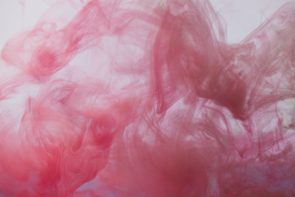 Abstract Ink kaleidoscope pattern background, featuring symmetrical ink splashes in vibrant colors on a white base. — base photo: An abstract ink splash captured against a clean white background. The fluid forms and vibrant colors
