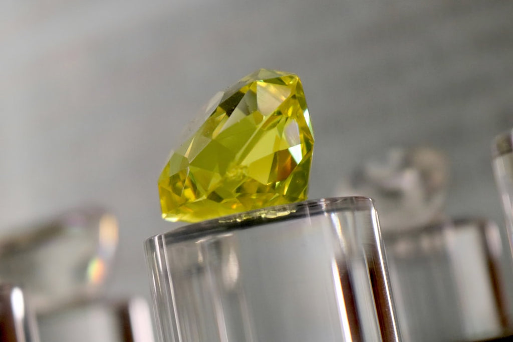Mineralogy Hexagon wallpaper pattern — base photo: a yellow diamond sitting on top of a glass block