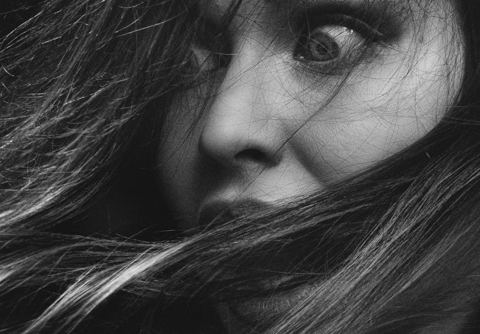 Emotions Wave wallpaper pattern — base photo: Intense monochrome close-up of a woman's expressive face and hair.