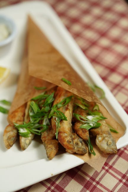 Seamless mirror wallpaper pattern — Origami by wallpaper⁶ — base photo: Close-up of deep-fried fish garnished with scallions, served in a paper wrap on a plate.