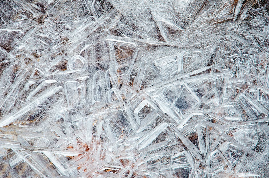 Molecular Physics Mirror wallpaper pattern — base photo: Detailed close-up of ice crystals forming complex patterns on a frozen surface.