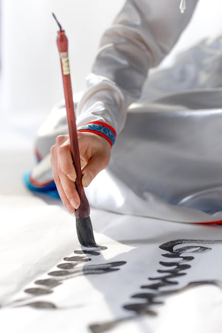 Seamless mirror wallpaper pattern — Calligraphy by wallpaper⁶ — base photo: Close-up of a hand using a traditional brush for calligraphy on white paper, highlighting cultural a