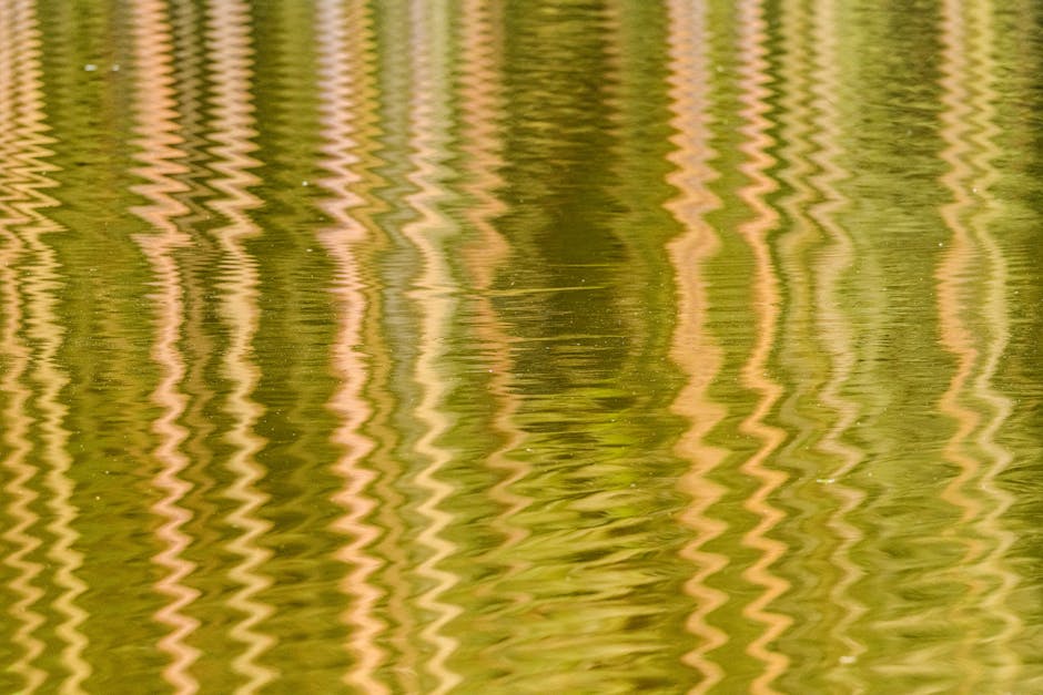 Seamless mirror wallpaper pattern — Glitch by wallpaper⁶ — base photo: Abstract image of colorful ripples reflecting on water surface, creating vibrant patterns.