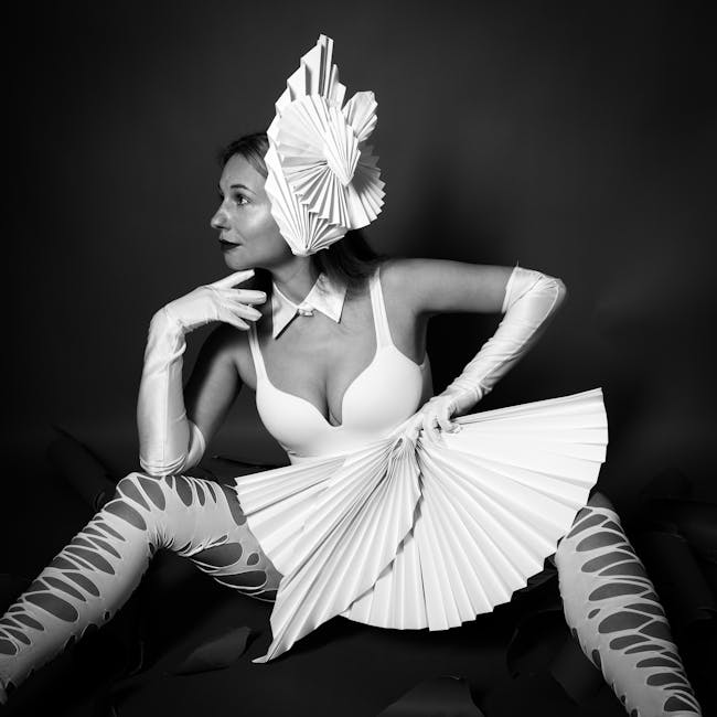 Seamless kaleidoscope wallpaper pattern — Origami by wallpaper⁶ — base photo: Expressive black and white portrait of a woman in avant-garde paper fashion.