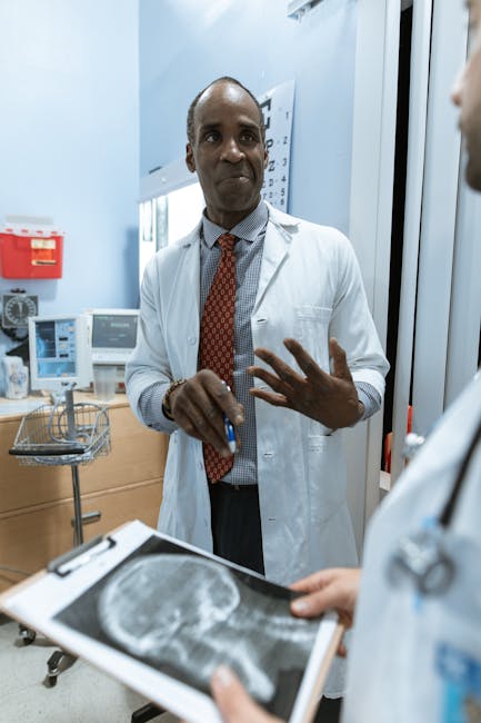 Seamless kaleidoscope wallpaper pattern — Medicine by wallpaper⁶ — base photo: Medical practitioners analyzing x-ray results in a clinical setting.