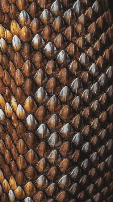 Close-up of brown reptile scales arranged in a detailed kaleidoscope pattern on self-adhesive wallpaper. — base photo: A striking close-up reveals the detailed texture of brown reptile scales. The intricate patterns and