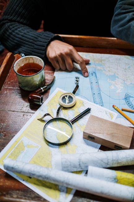 Seamless mirror wallpaper pattern — Cartography by wallpaper⁶ — base photo: Man planning a journey with nautical maps, compass, and navigational tools on a wooden table.
