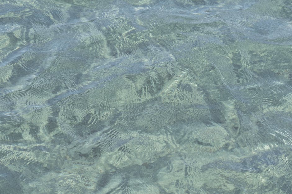 Oceanography Wave wallpaper pattern — base photo: Close-up view of ocean water with gentle ripples, creating a calming texture.