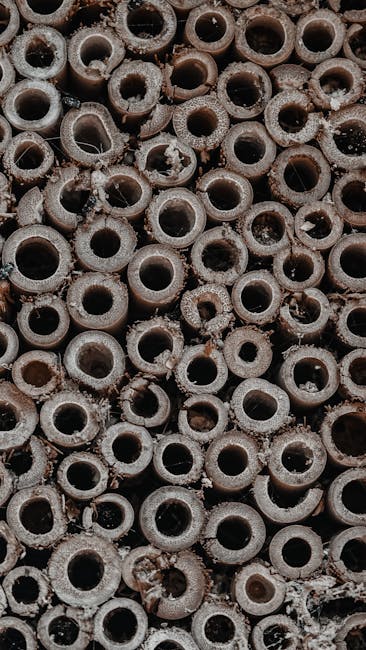 Seamless mirror wallpaper pattern — Geometry by wallpaper⁶ — base photo: Macro shot of textured, aged wooden circles arranged in a dense pattern, offering gritty details.
