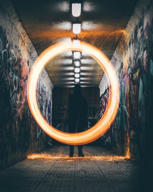 Seamless kaleidoscope wallpaper pattern — Glitch by wallpaper⁶ — base photo: A silhouette in a graffiti-covered tunnel with a vibrant neon light circle creates a captivating urb