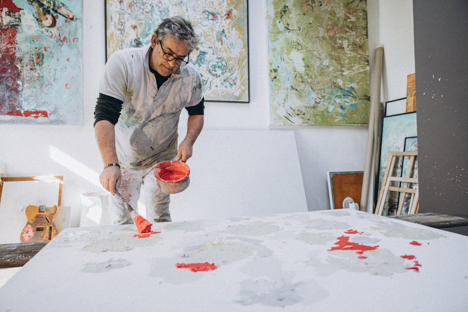 Abstract Kaleidoscope wallpaper pattern — base photo: Artist with gray hair painting in a vibrant studio environment. Captivating and colorful artwork.