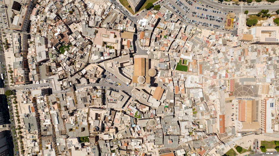 Seamless brick wallpaper pattern — Cartography by wallpaper⁶ — base photo: Aerial view of a densely packed urban cityscape showcasing diverse architecture.