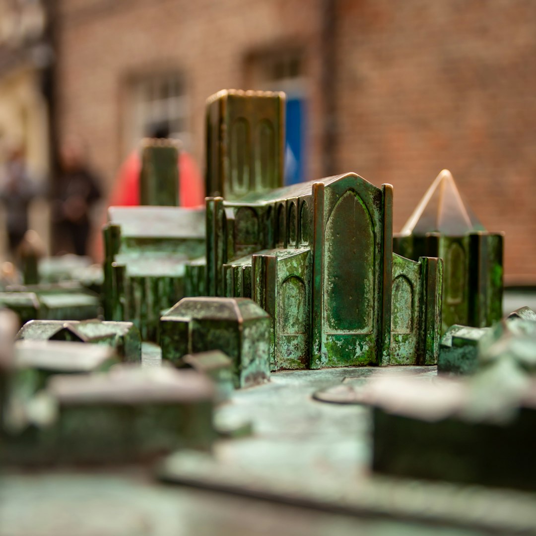WALLPAPER⁶ — seamless rotate4 pattern from constructivism art, Bauhaus — base photo: A detailed miniature model of a historic cityscape