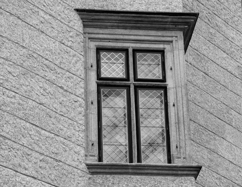 Close-up of hexagonal leaded glass pattern in black and white, inspired by Gothic architecture, in a stone window frame. — base photo: A stark, black and white close-up of an aged stone window, its leaded glass panes arranged in a geom