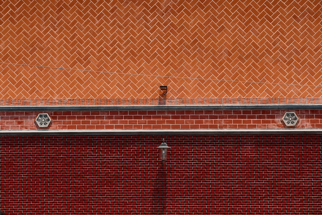 Seamless kaleidoscope wallpaper pattern — Geometry by wallpaper⁶ — base photo: Two different brick patterns on a building wall