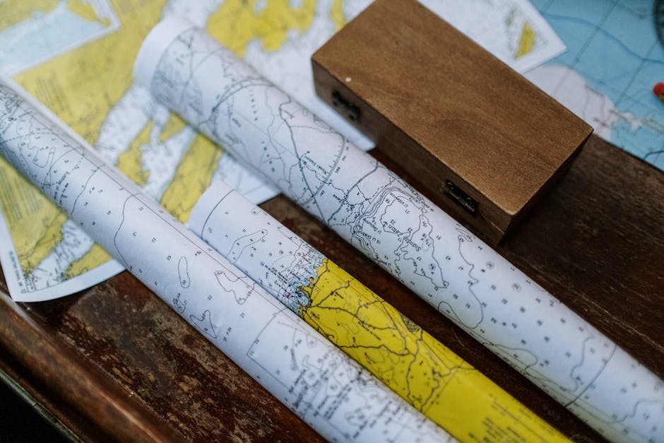 Seamless brick wallpaper pattern — Cartography by wallpaper⁶ — base photo: Close-up of rolled nautical maps on a wooden table, perfect for navigation themes.