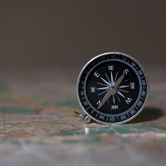 A seamless kaleidoscope pattern featuring repeating brass compasses and topological map lines in shades of gold and parchment. — base photo: A close-up, high-detail photograph by Саша Алалыкин featuring a brass compass placed atop a weathere