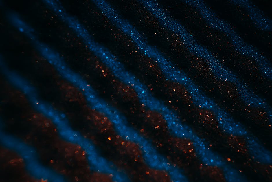 Seamless hex wallpaper pattern — Arithmetic by wallpaper⁶ — base photo: A close-up view of blue and red glitter creating a captivating abstract texture, perfect for backgro