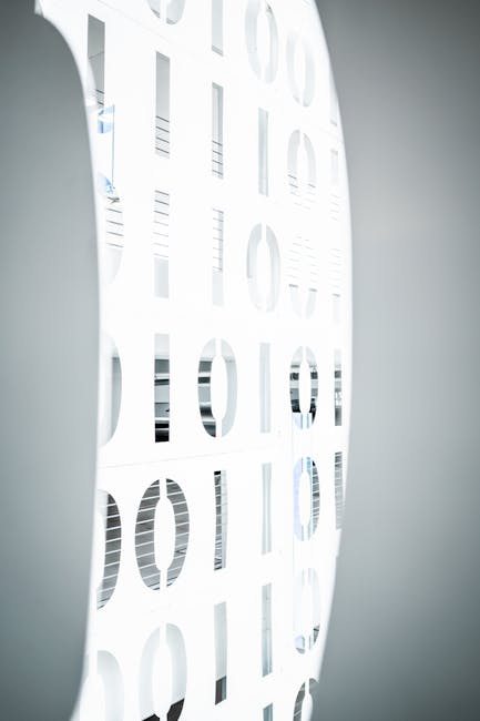 Seamless kaleidoscope wallpaper pattern — Arithmetic by wallpaper⁶ — base photo: Stylish interior office design featuring an illuminated binary pattern wall, symbolizing modern digi