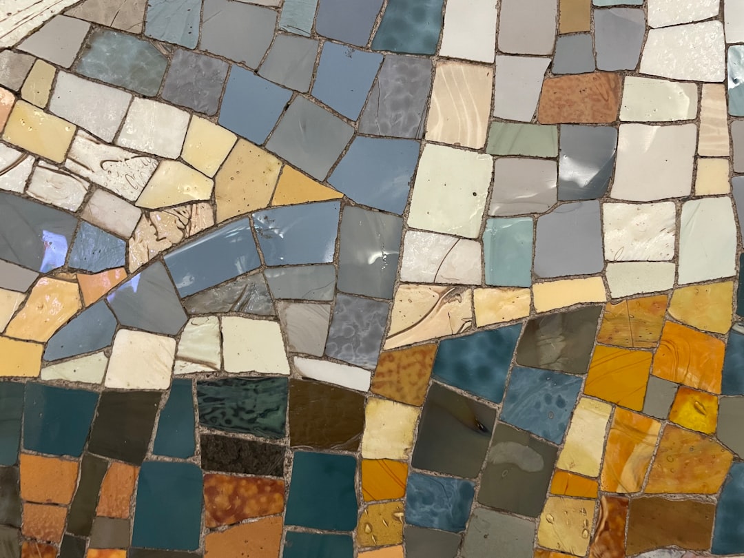 Seamless kaleidoscope wallpaper pattern — Origami by wallpaper⁶ — base photo: a close up of a mosaic tile wall