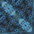 Close-up of rough blue and gray stone texture arranged in a diamond symmetry pattern on wallpaper.