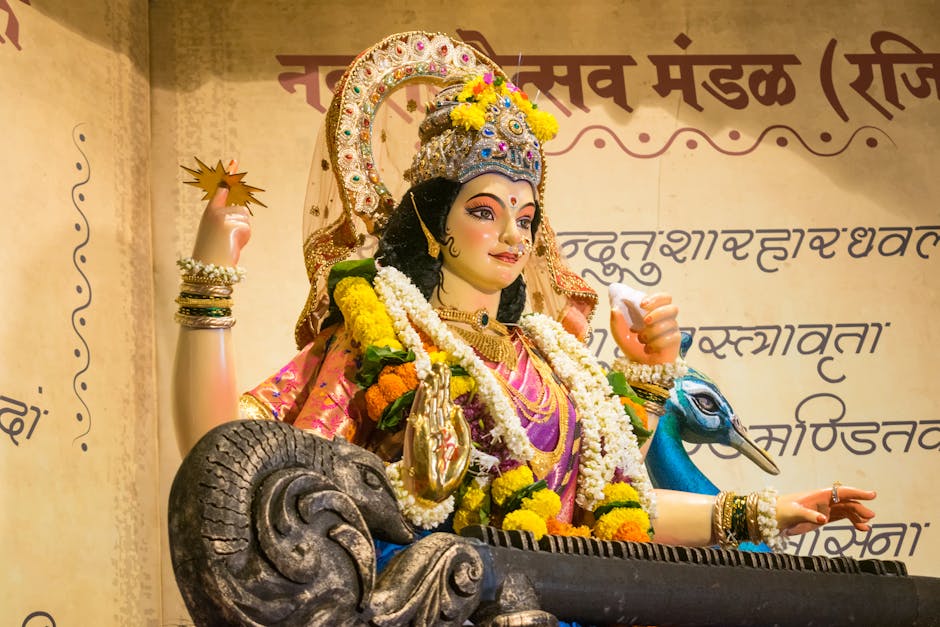 Seamless mirror wallpaper pattern — Calligraphy by wallpaper⁶ — base photo: Colorful statue of a Hindu goddess adorned with flowers during Navratri in Mumbai, India.