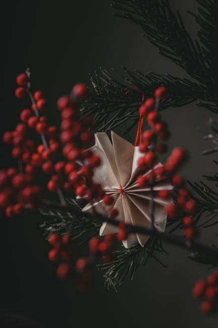 Seamless mirror wallpaper pattern — Origami by wallpaper⁶ — base photo: Fir tree decorated with creative handmade paper toy and red ashberry twig in darkness