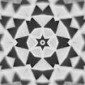 Black and white kaleidoscope pattern inspired by molecular physics and phonon dispersion on a wall.