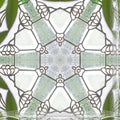 A close-up of a repeating kaleidoscope pattern inspired by leaded stained glass details, with intricate lines and vibrant colors visible.