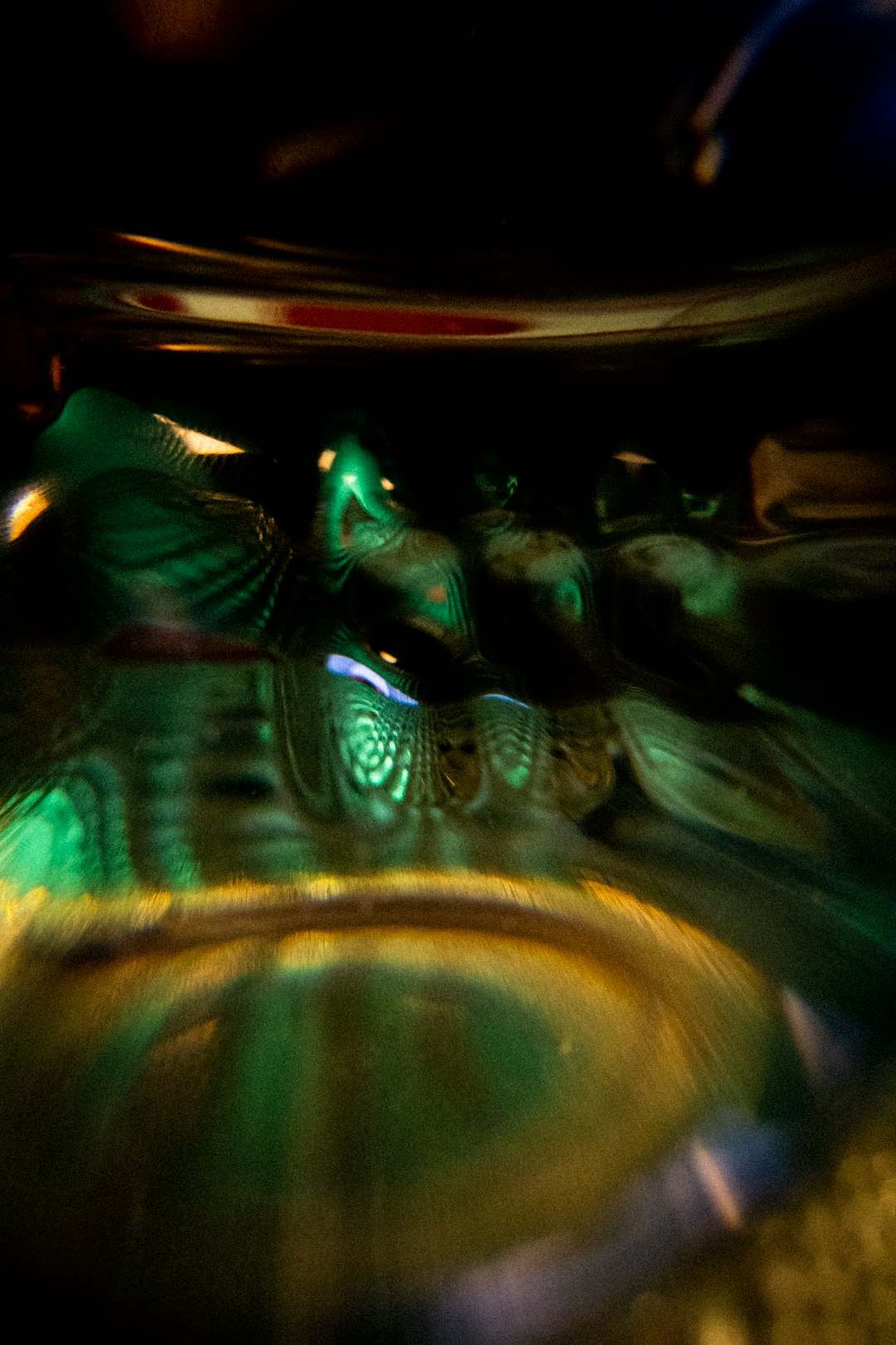 Abstract pattern of glass textures and green light, arranged in a diamond symmetry, inspired by lab beakers. — base photo: A macro shot focuses on a glass plate, likely from laboratory equipment, bathed in a soft, ambient g