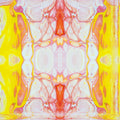 A symmetrical abstract pattern of cyan and teal crystalline shapes mirrored vertically and horizontally on a dark background.