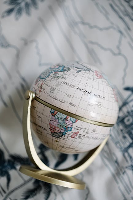 Seamless hex wallpaper pattern — Cartography by wallpaper⁶ — base photo: Classic vintage globe captured on a detailed patterned fabric, showcasing world geography with a tim