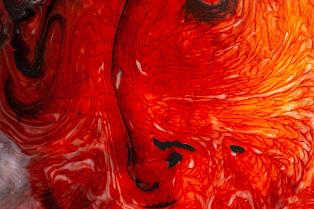Abstract kaleidoscope pattern created from swirling inks in milk, with organic shapes reflected infinitely. — base photo: Macro shots capture the ephemeral dance of colorful inks mingling with milk. Organic, cloud-like for