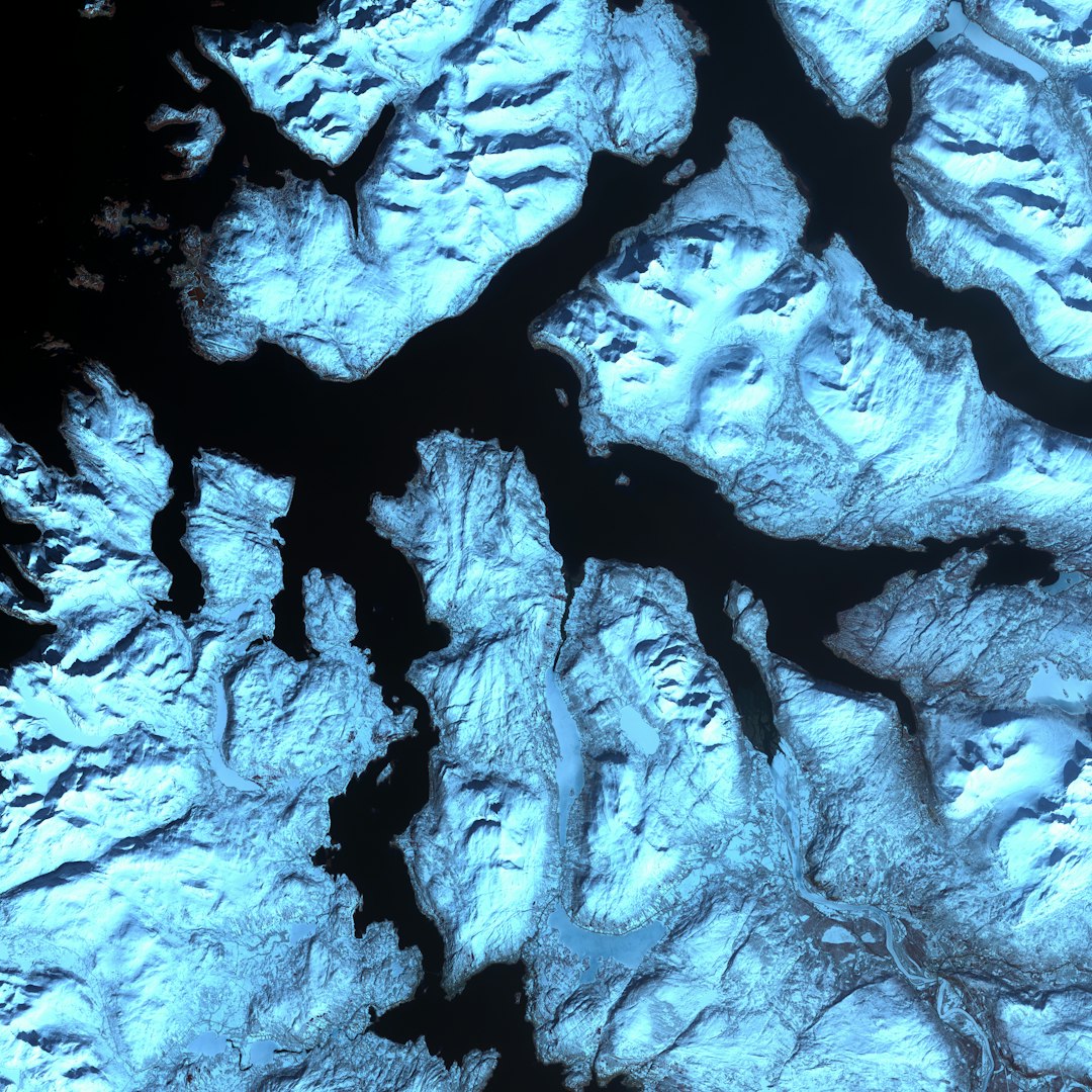 WALLPAPER⁶ — seamless mirror4 pattern from topological surface, Topology — base photo: Like dark fingers, cold ocean waters reach deeply into the mountainous coastline of northern Norway,