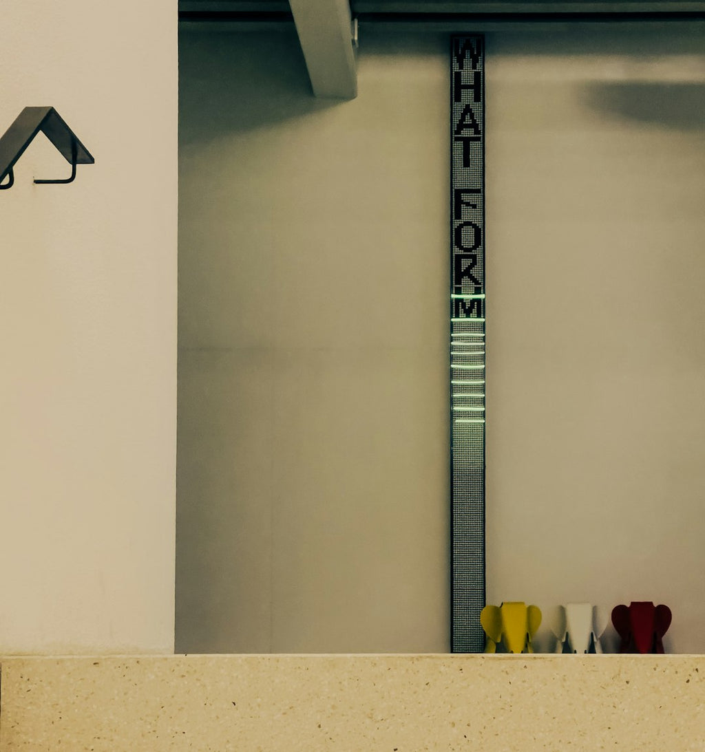 WALLPAPER⁶ — seamless mirror4 pattern from bauhaus design, Bauhaus — base photo: Vertical sign reads "what for m" with colorful objects below.