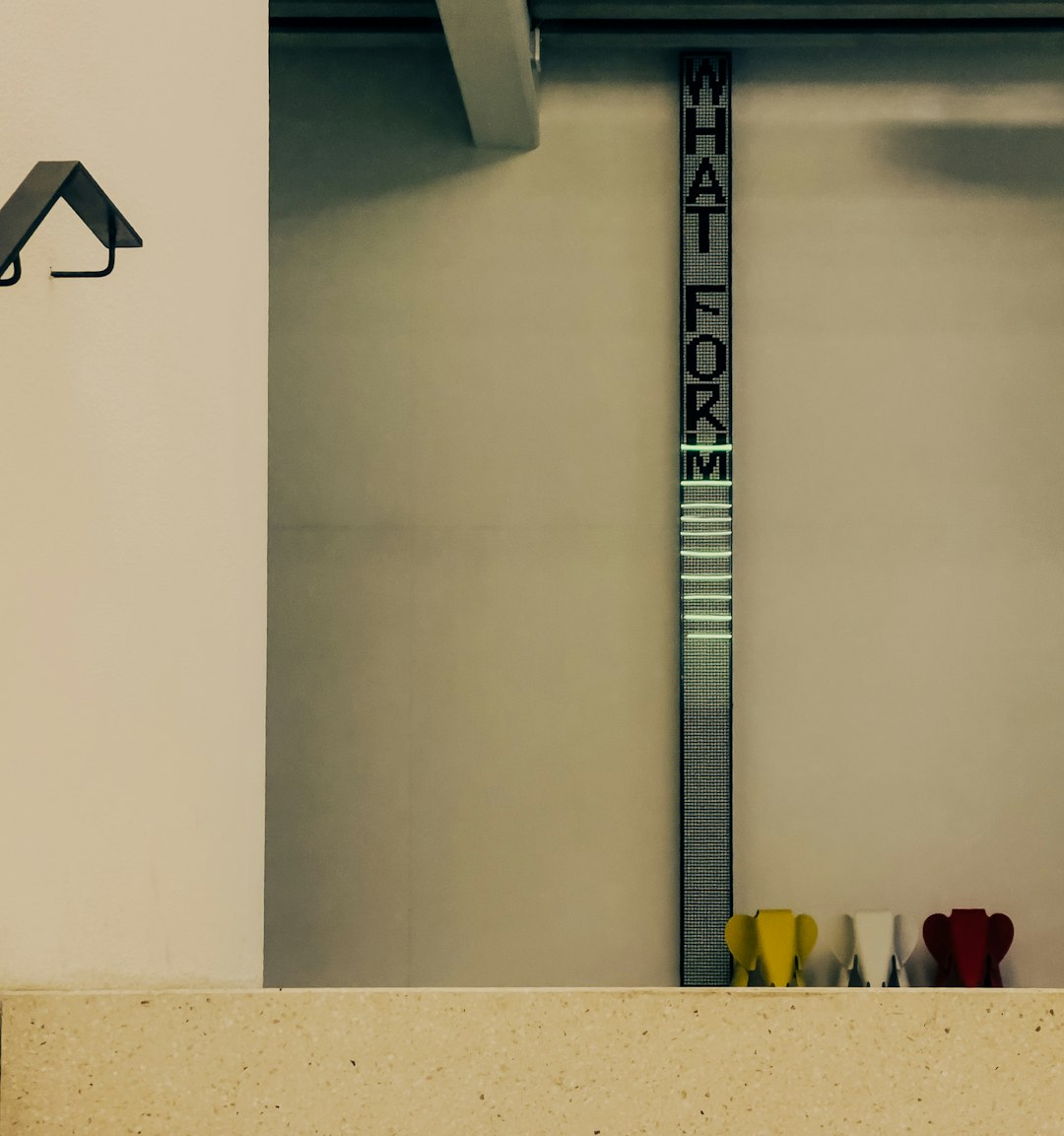 WALLPAPER⁶ — seamless mirror4 pattern from bauhaus design, Bauhaus — base photo: Vertical sign reads "what for m" with colorful objects below.