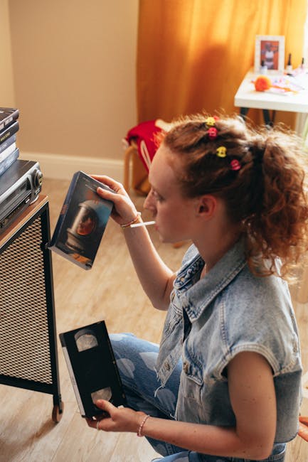 Seamless mirror wallpaper pattern — Glitch by wallpaper⁶ — base photo: Woman enjoying nostalgic VHS tapes in a cozy indoor setting, reliving the 90s charm.