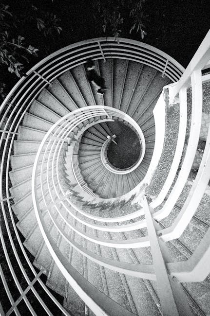 Seamless rotation wallpaper pattern — Algebra by wallpaper⁶ — base photo: Black and white image of a man walking on a spiral staircase.