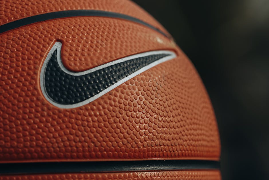 Seamless mirror wallpaper pattern — Geometry by wallpaper⁶ — base photo: Detailed close-up shot of a basketball showing texture and brand logo.