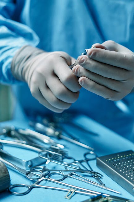 Seamless mirror wallpaper pattern — Medicine by wallpaper⁶ — base photo: Close-up of surgeon's hands preparing tools for surgery in operating room.