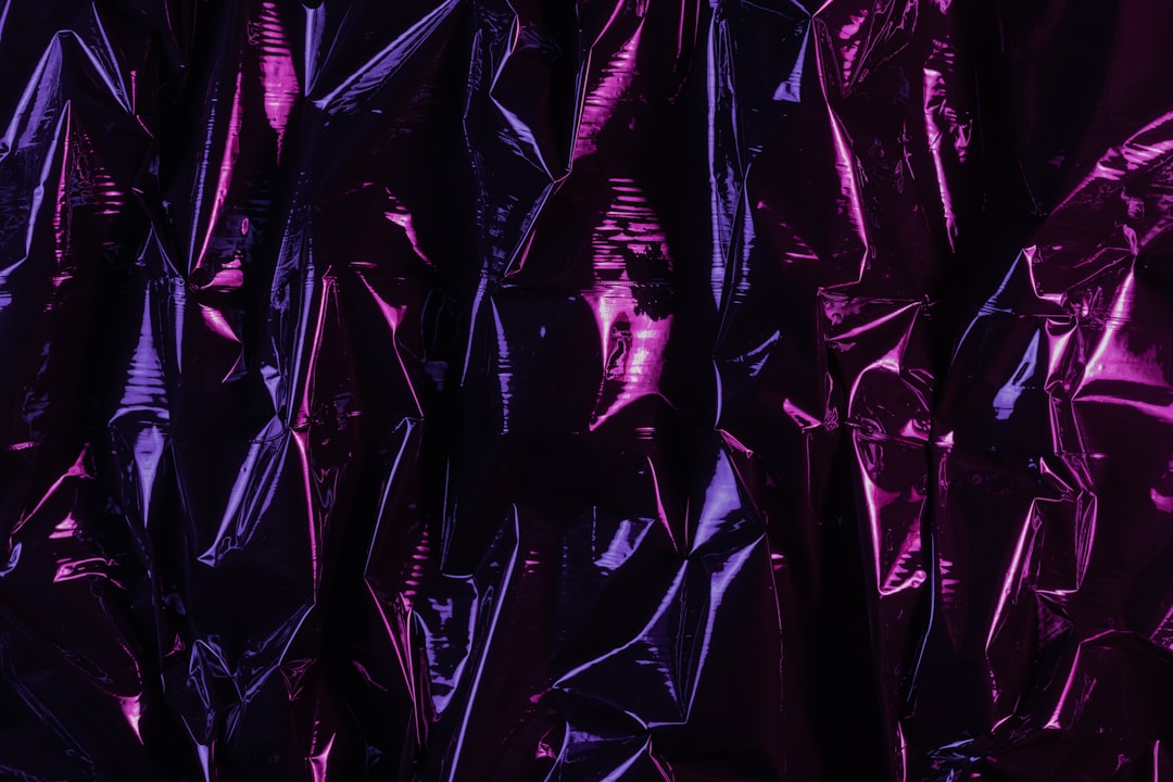 Seamless kaleidoscope wallpaper pattern — Cosmology by wallpaper⁶ — base photo: Black plastic foil lit with two improvised color gel lamps.