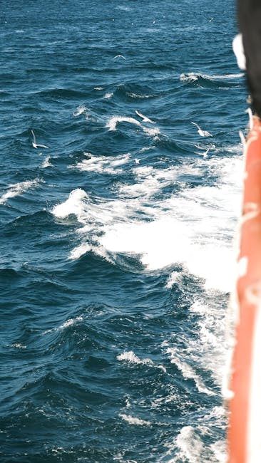 Oceanography Wave wallpaper pattern — base photo: Vibrant blue ocean waves viewed from a boat on a sunny day.